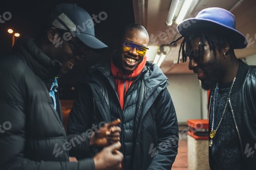 Preview: three african men standing in the street and having conversation