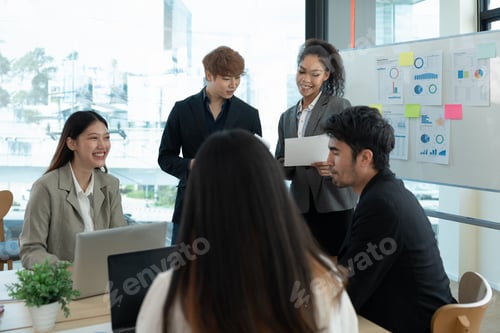Preview: Group of diverse colleagues discussing for financial report with presentation on flipchart during a