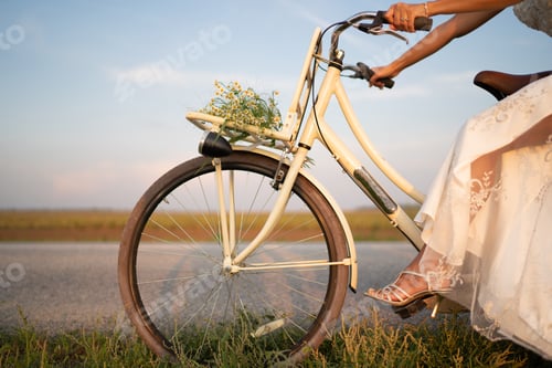 Preview: The bride is riding a bicycle