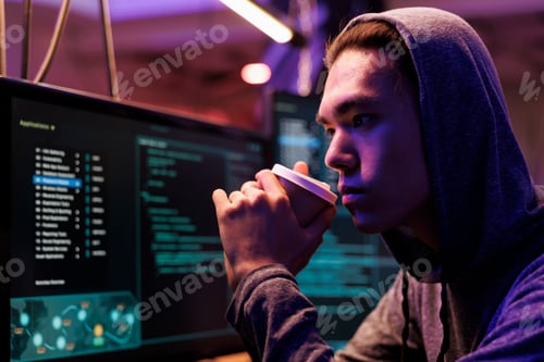 Preview: Asian hacker drinking coffee
