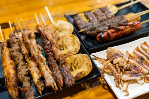 Preview: Variety of meat skewers on dish