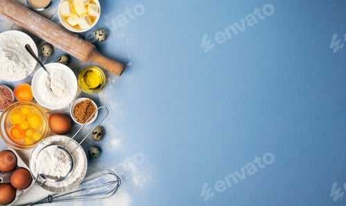 Preview: Baking ingredients on blue color background, top view