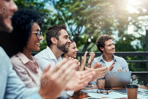 Preview: Shot of a group of colleagues applauding during a meeting at a cafe