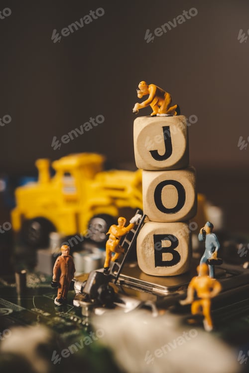 Preview: Miniature people or small figure worker on wood block with the word "job"