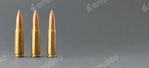 Preview: Three bullets on gray background. Cartridges 7.62 caliber for Kalashnikov assault rifle