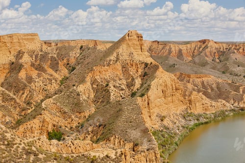 Preview: Red clay erosion gully and river. Eroded landscape. Spain