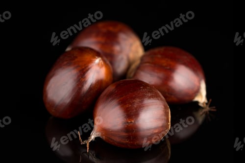 Preview: Chestnuts on a black reflective background