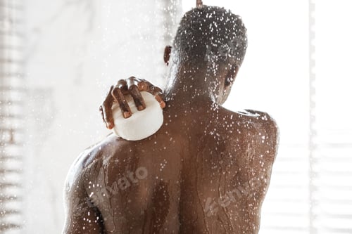 Preview: African Man Washing Back With Sponge Taking Shower In Bathroom