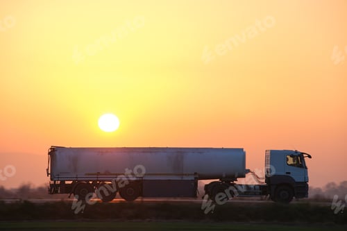 Preview: Semi-truck with tipping cargo trailer transporting sand from quarry driving on highway