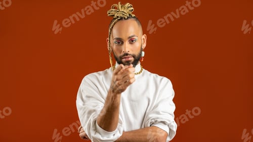 Preview: African american gay points index finger at camera