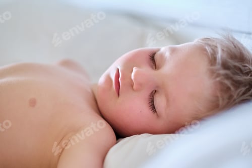 Preview: Toddler boy sleeping on pillow