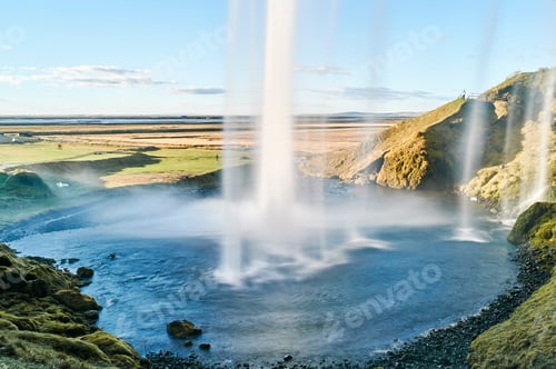 Preview: Behind flowing waterfall Seljalandsfoss, Iceland