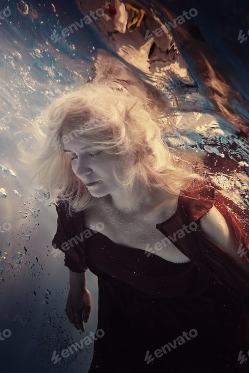 Preview: Portrait Of A Woman In A Red Dress Underwater