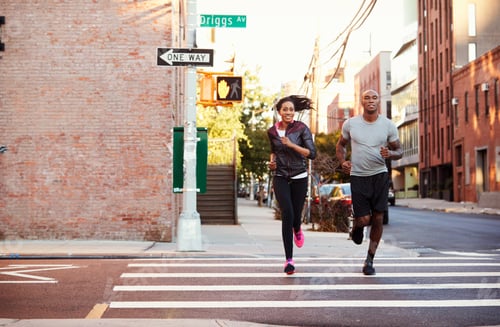 Preview: Young black couple jogging in Brooklyn street