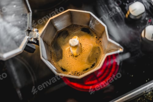 Preview: Italian Aluminum Coffee Maker Brewing a Fresh Dark Coffee on the