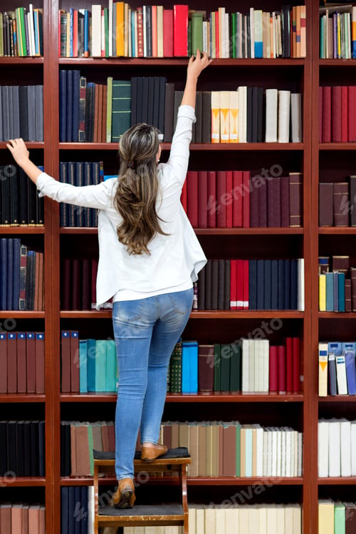 Preview: Woman At The Library Trying To Reach A Book