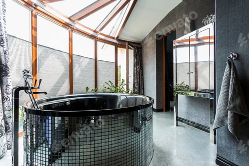 Preview: Luxurious bathroom with freestanding glossy bathtub