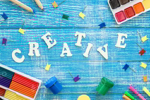 Preview: Colorful school stationery on a wooden background, creative concept, top view.