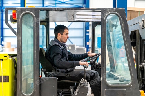 Preview: Man driving a forklift in a factory
