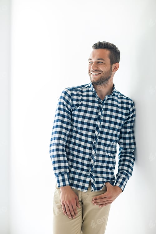 Preview: Smiling Man in Blue Plaid Shirt Indoors