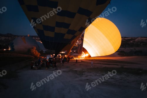 Preview: inflating hot air balloons at night