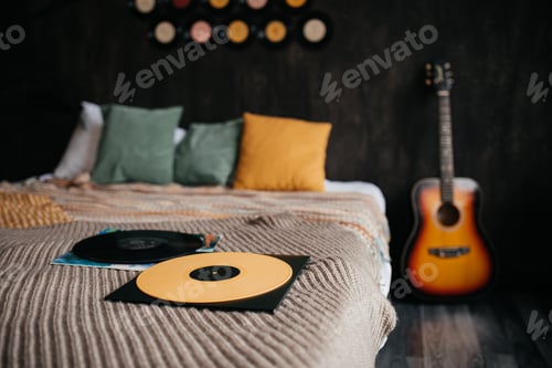 Preview: Vinyl records on a bed in a cozy room