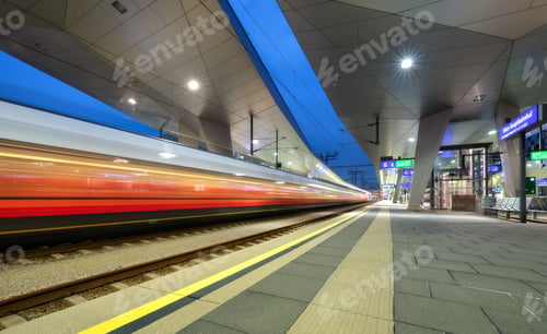 Preview: High speed train in motion on the railway station at night