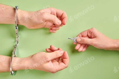 Preview: Release of prisoner. Hands in handcuffs