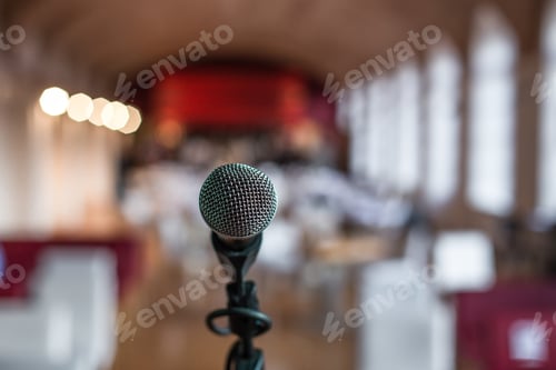 Preview: Closeup shot of a microphone in a restaurant with a blurred background