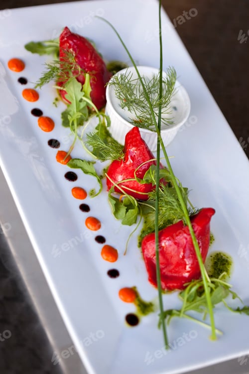 Preview: Roasted Red Peppers Garnished with Sauce and Herbs