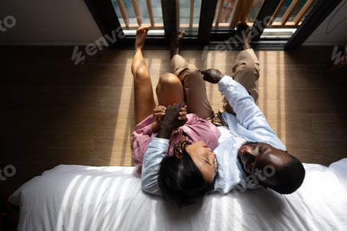 Preview: Interracial couple enjoying a joyful and intimate moment, embracing love, laughter, and togetherness