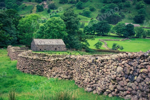 Preview: Old stone wall and a house in the Lake District, England