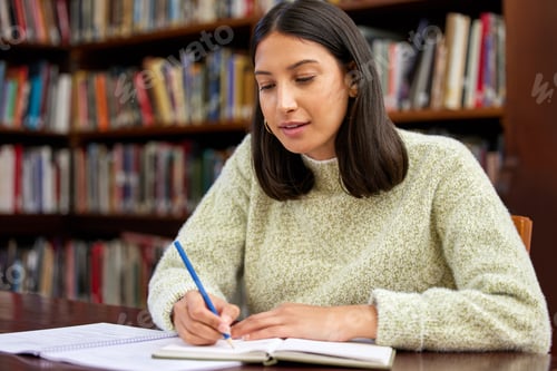 Preview: Its the little things that matter. Shot of a young woman studying in a college library.