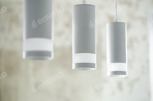 Preview: Chandelier in the interior of the room, lamps in white shades.
