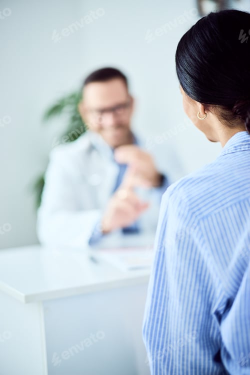 Preview: Professional Medical Consultation Between Doctor and Patient in a Modern Office Setting