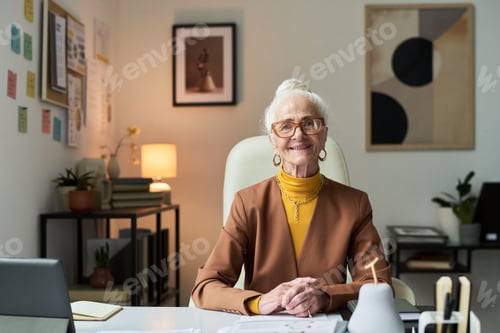 Preview: Portrait of Senior Woman Working in Modern Office Setting