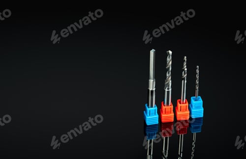 Preview: Special tools isolated on black background. Made to order special tools. Coated step drill detail.