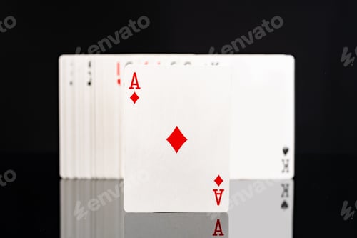 Preview: Playing cards on black background studio shot