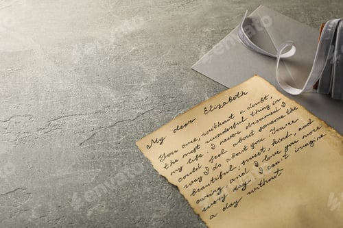 Preview: Vintage letter with text, envelope and ribbon on gray background, space for text
