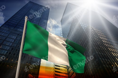 Preview: Nigeria National Flag Against Low Angle View Of Skyscrapers At Sunset