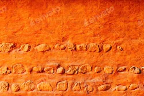 Preview: Old orange wall with rocks, scandinavian architecture style background