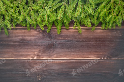 Preview: Christmas background. Christmas fir tree branches on a dark wooden background with copy space