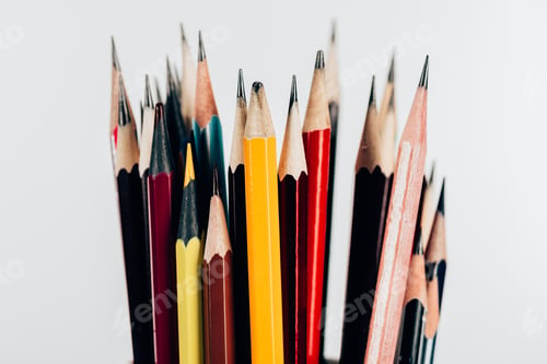 Preview: Close-up view of colorful pencils in mess isolated on white background