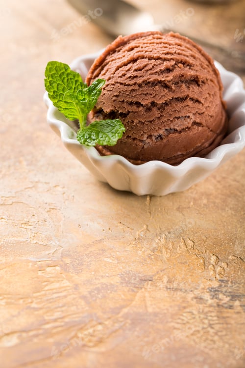 Preview: Chocolate ice cream in white bowl.