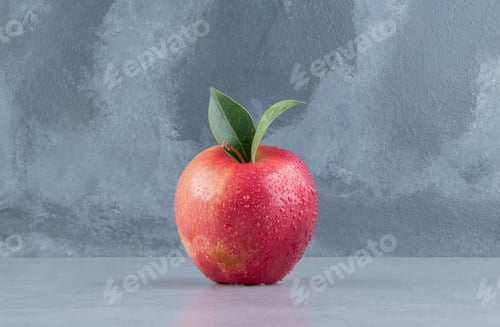 Preview: A delectable apple displayed on marble background