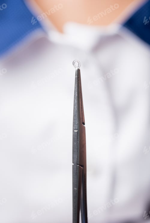 Preview: Dentist holding dental tool. Orthodontic treatment. Dentistry