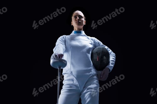 Preview: Charming Girl Dressed As A Fencer Posing With A Mask And A Sword. The Concept Of Fencing. Mixed
