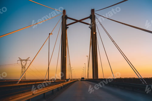 Preview: Driving over bridge at sunset