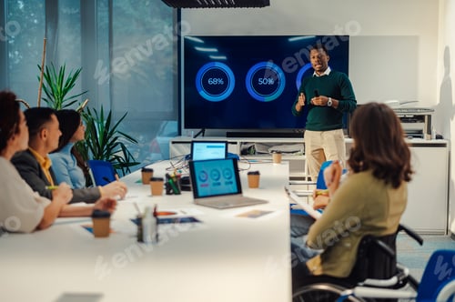 Preview: Multiracial business team having a meeting in a modern bright office interior