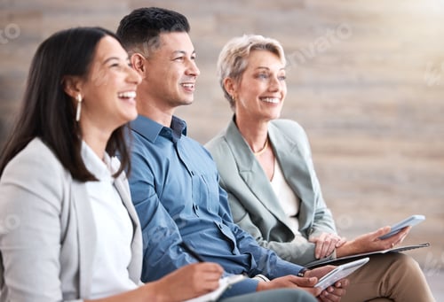 Preview: Diverse group of smiling business people sitting together in office training with copyspace. Happy